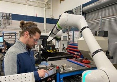 The shop is implementing an automation plan to help it expand capacity. This Acieta FastLoad system with a cobot arm and staging area for parts will be used for machine tending in the turning and milling departments.